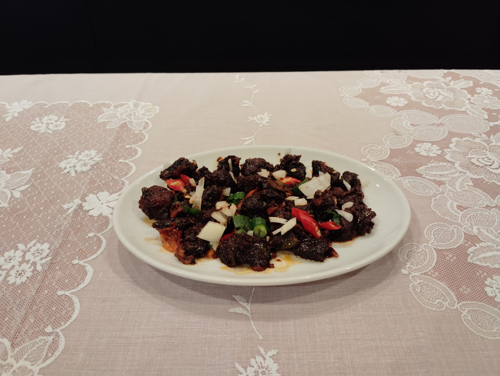 Mutton sukuti on a white plate